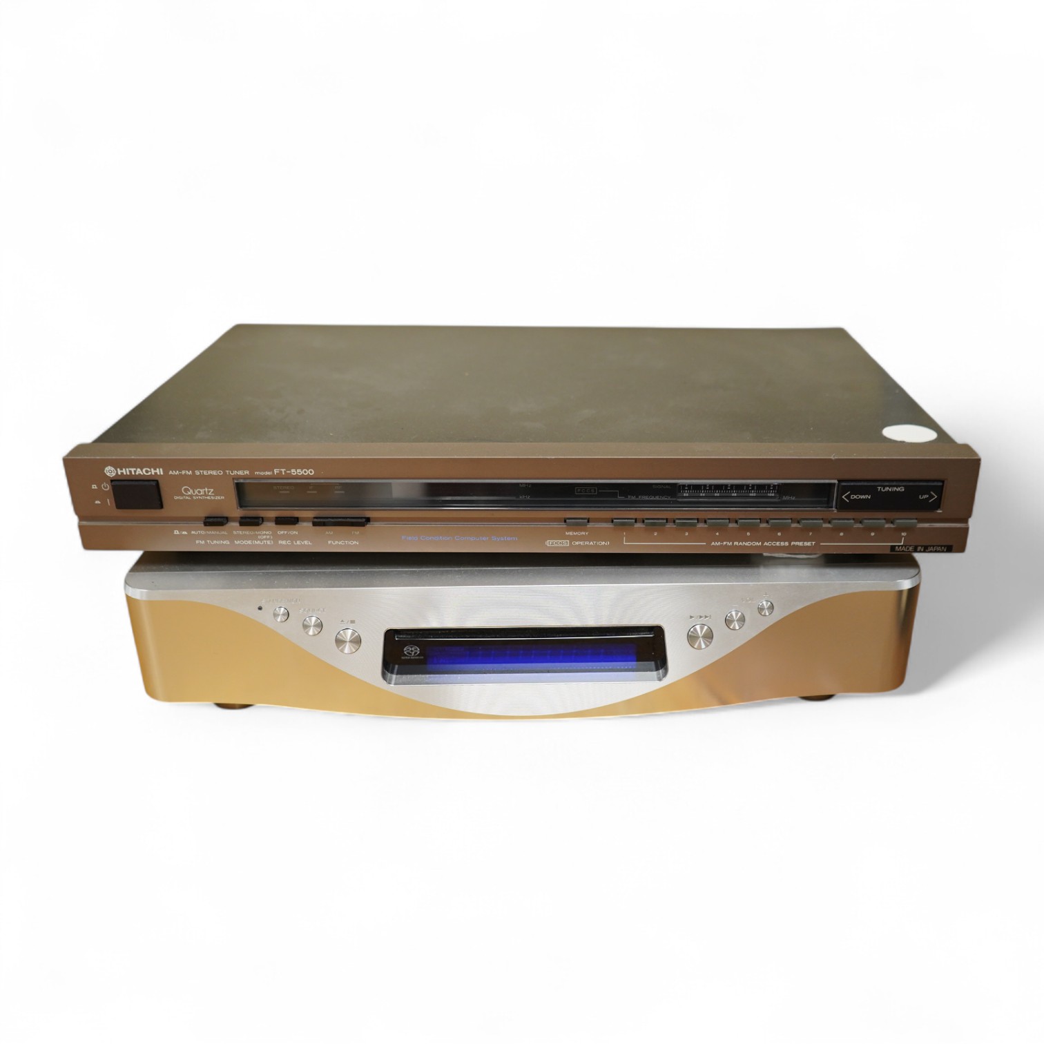 An Esoteric RZ-1 Integrated Music System, amplifier SACD/CD player, together with a Hitachi FT-5500 AM/FM stereo tuner, plus cables.
